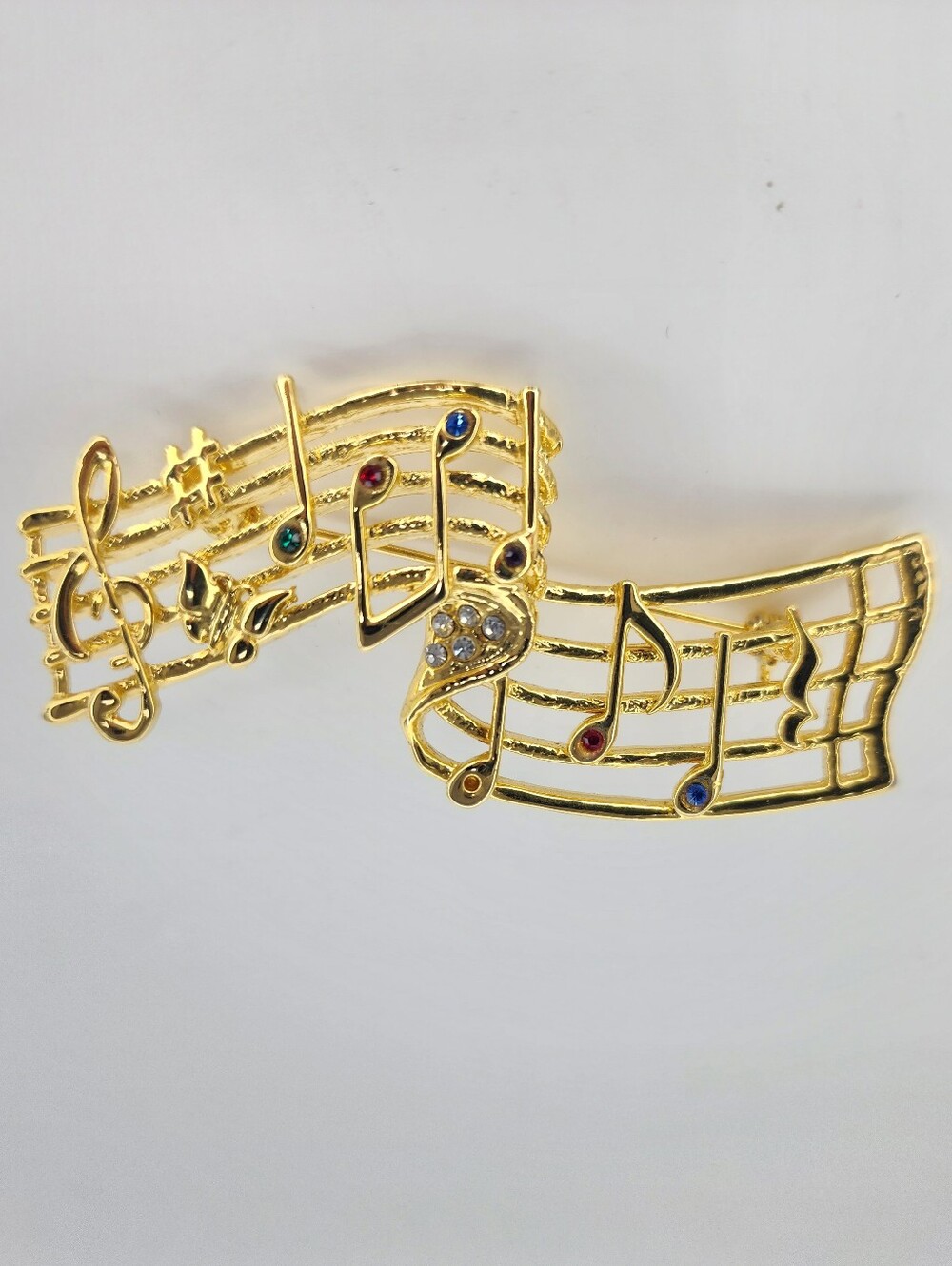 Gold-Tone Musical Notes Brooch with Multicolor Accents